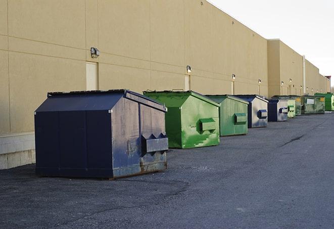 a row of construction dumpsters parked on a jobsite in Nancy